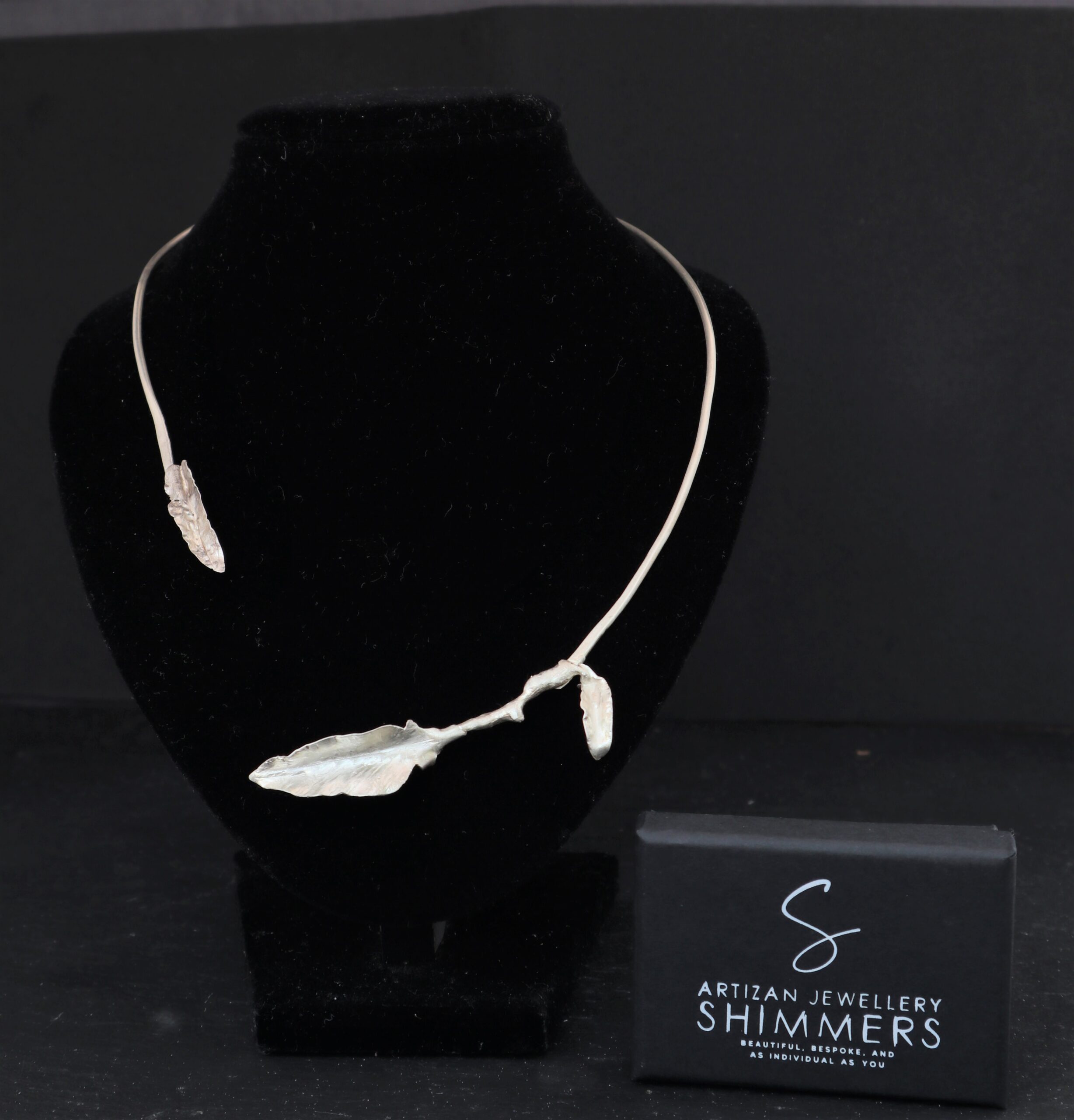 A beautiful, bespoke torc formed to resemble a twig with hand formed leaves